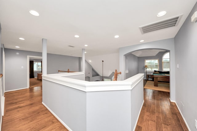 corridor featuring hardwood / wood-style floors