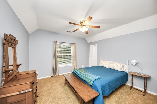 bedroom featuring lofted ceiling, light carpet, ceiling fan, and a closet