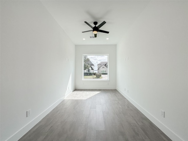 unfurnished room featuring ceiling fan and wood-type flooring