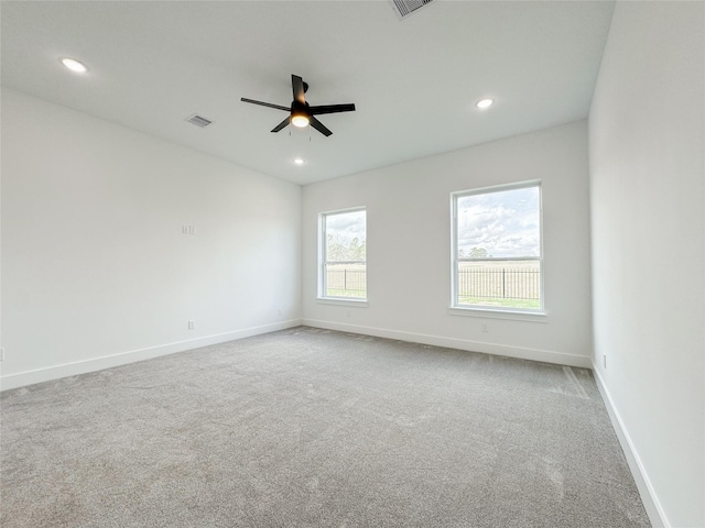 carpeted empty room with ceiling fan