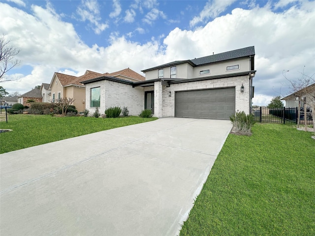 view of front of property with a garage and a front yard