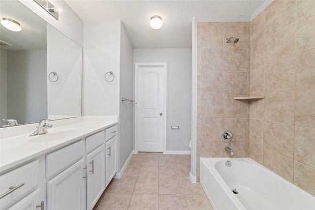 full bathroom featuring vanity, tile patterned floors, toilet, and tiled shower / bath