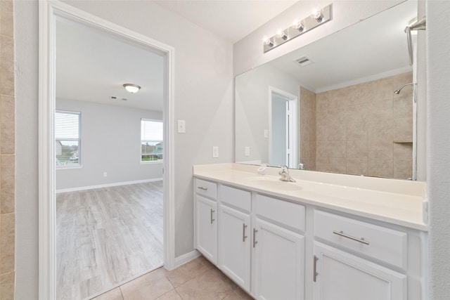 bathroom with tile patterned floors and vanity