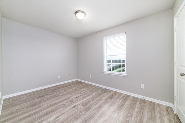 spare room featuring light hardwood / wood-style floors