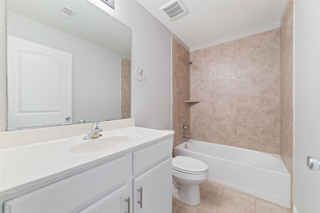 full bathroom with tiled shower / bath, vanity, tile patterned floors, and toilet