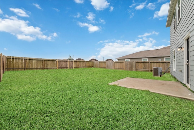 view of yard featuring central AC and a patio area