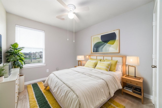 bedroom featuring ceiling fan and light wood-type flooring