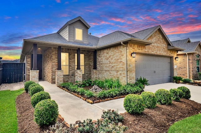 view of front of property with a garage