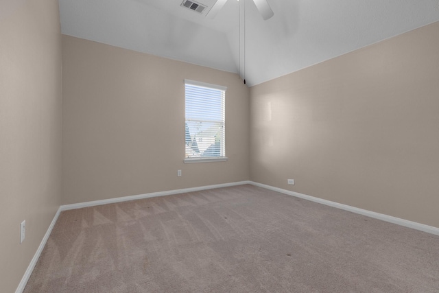 carpeted spare room with lofted ceiling and ceiling fan