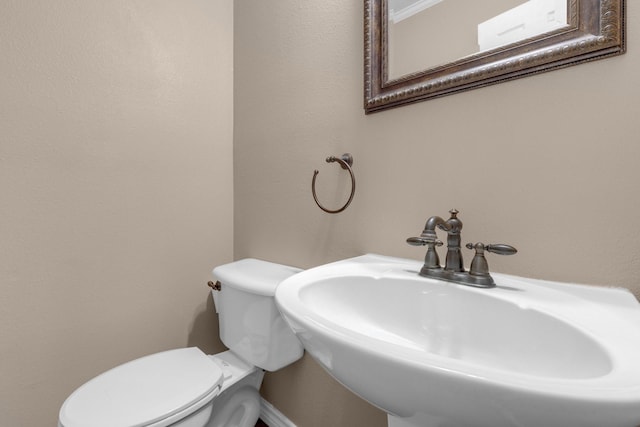 bathroom with sink and toilet