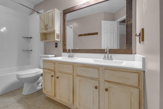 full bathroom featuring vanity, tile patterned floors, toilet, and washtub / shower combination