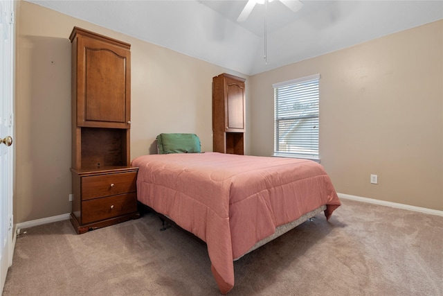 carpeted bedroom featuring vaulted ceiling and ceiling fan