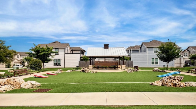 view of home's community with a gazebo and a lawn