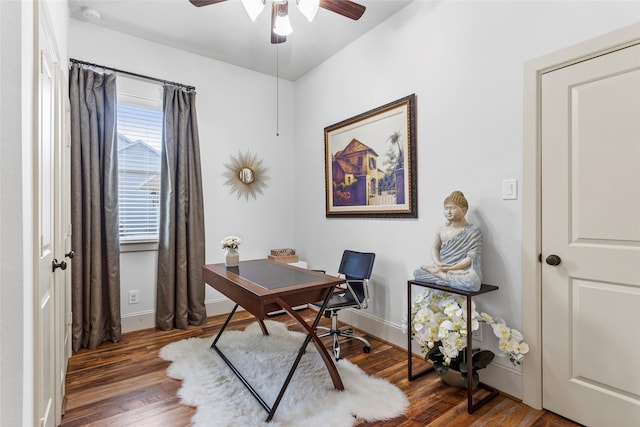 home office with baseboards, a ceiling fan, and wood finished floors