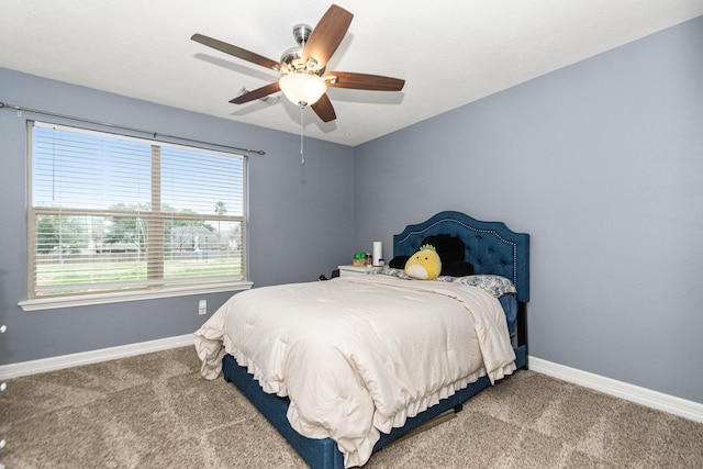 bedroom featuring ceiling fan and carpet floors