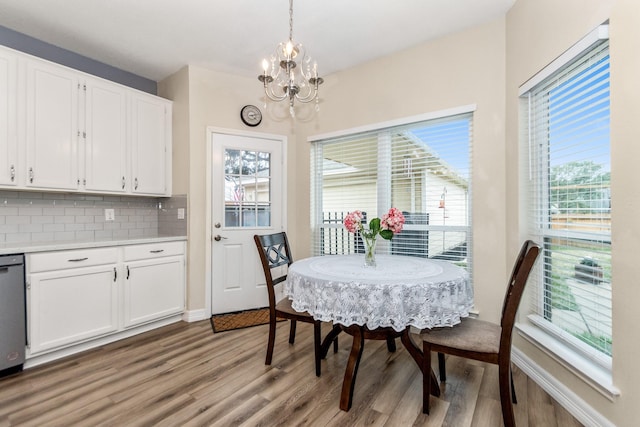 dining room with an inviting chandelier and light wood-type flooring