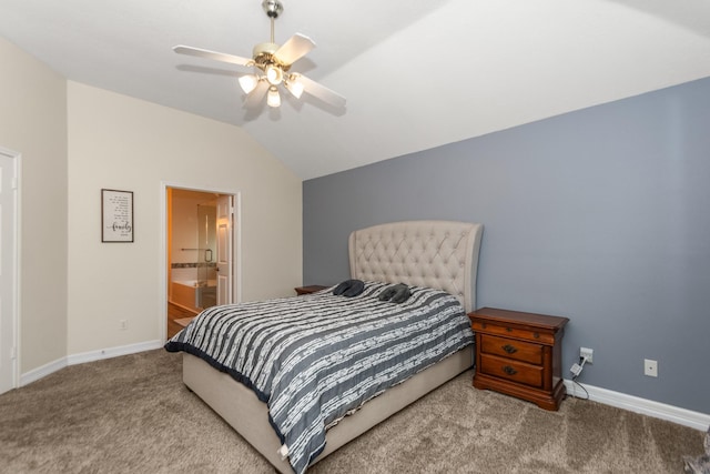 carpeted bedroom featuring vaulted ceiling, ensuite bathroom, and ceiling fan