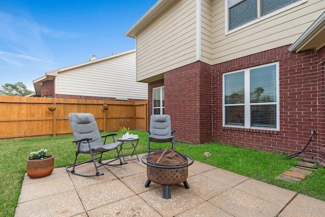 view of patio / terrace with a fire pit