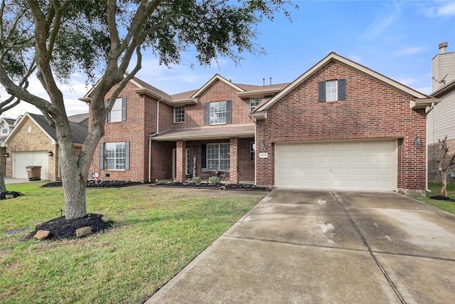 view of property featuring a garage and a front lawn