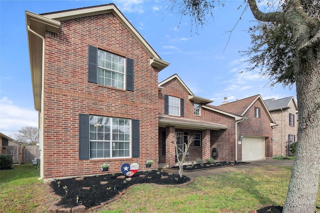 view of front of house with a garage and a front yard