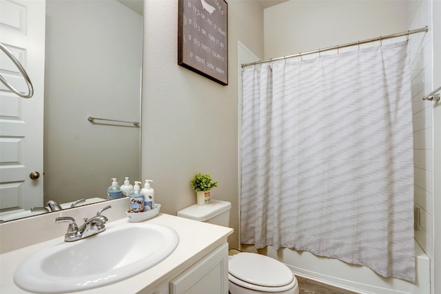 full bathroom featuring shower / bathtub combination with curtain, vanity, and toilet