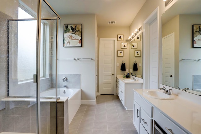 bathroom with vanity, tile patterned floors, and separate shower and tub