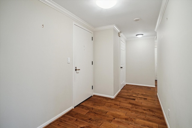 corridor featuring dark hardwood / wood-style flooring and crown molding