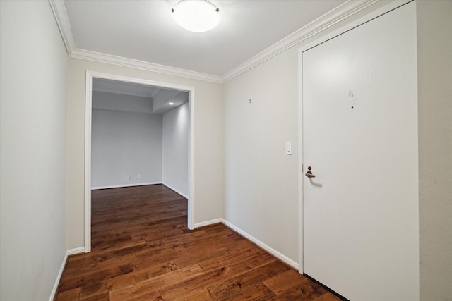 hallway with ornamental molding and dark hardwood / wood-style flooring