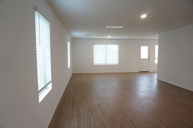 empty room featuring dark wood-type flooring