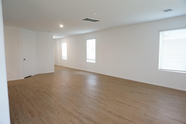 empty room with wood-type flooring