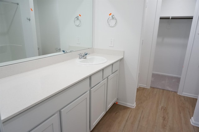 bathroom featuring vanity and hardwood / wood-style floors