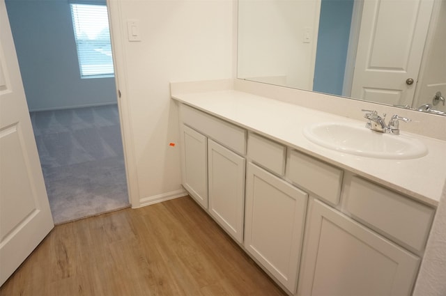 bathroom with wood-type flooring and vanity