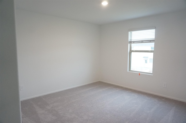 unfurnished room with carpet floors