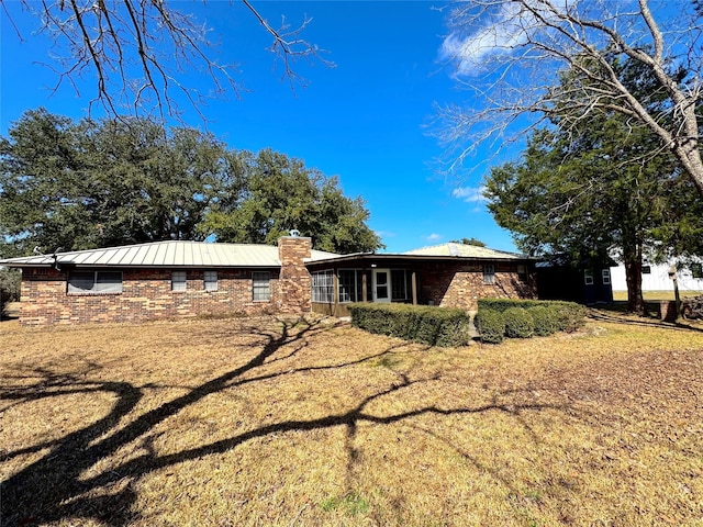 exterior space with a yard