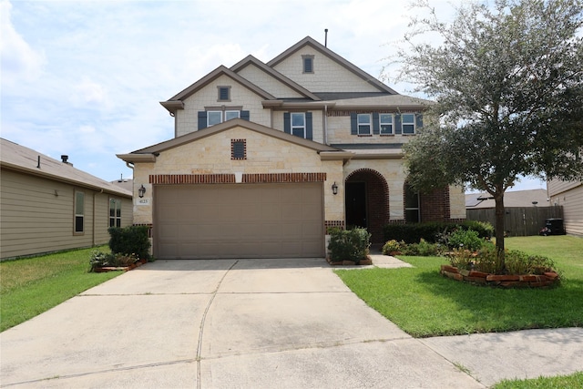 view of front of house featuring a garage and a front yard