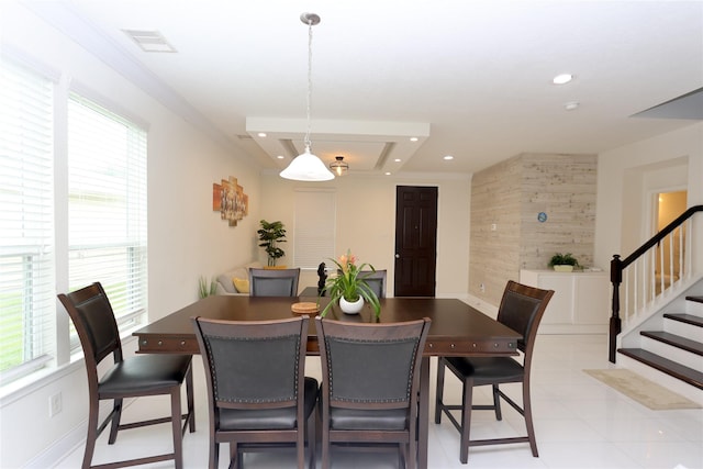 dining space featuring wooden walls