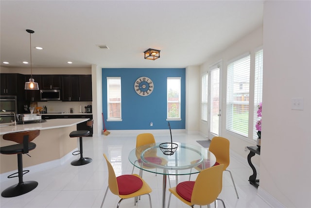 tiled dining area with sink