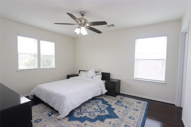 bedroom featuring dark hardwood / wood-style floors and ceiling fan