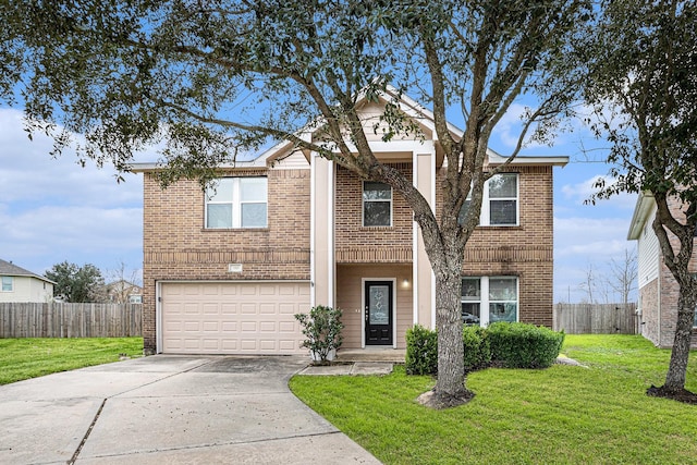 view of front of home with a front lawn and a garage