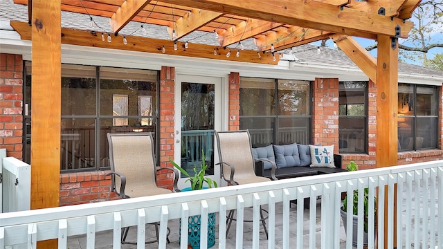 exterior space with an outdoor hangout area and a pergola