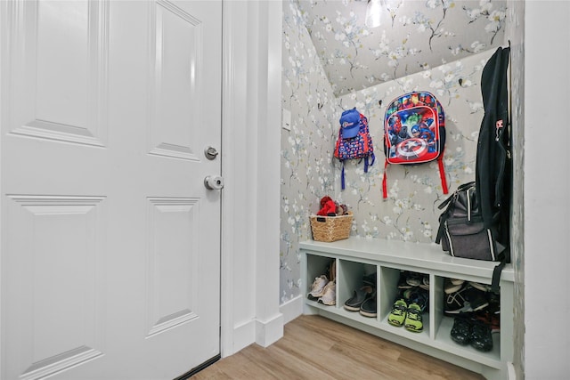 mudroom featuring wallpapered walls and light wood finished floors