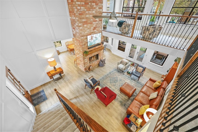 living area with wood finished floors and a decorative wall