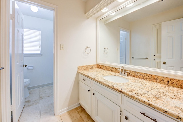 bathroom featuring vanity and toilet