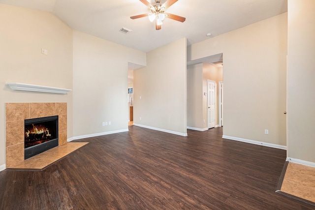 11430 Alcott Dr, Montgomery, TX 77356 - unfurnished living room featuring a fireplace, ceiling fan, vaulted ceiling, and dark hardwood / wood-style flooring