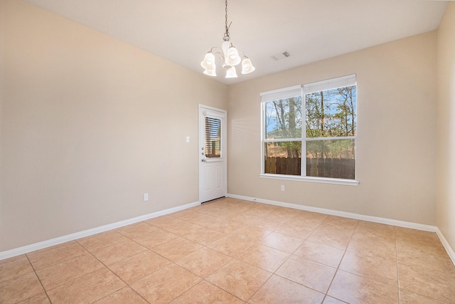 11430 Alcott Dr, Montgomery, TX 77356 - unfurnished room featuring an inviting chandelier and light tile patterned floors