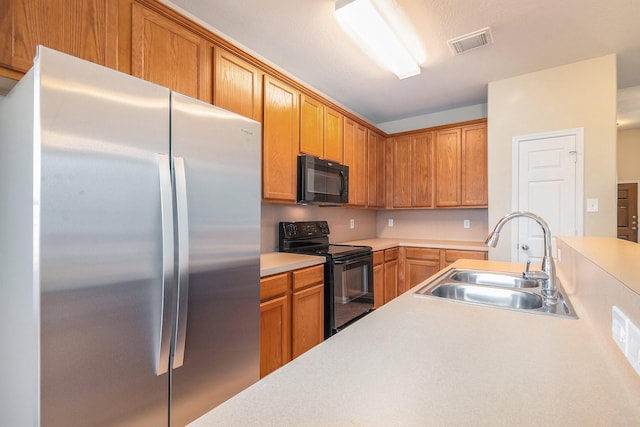 11430 Alcott Dr, Montgomery, TX 77356 - kitchen with sink and black appliances