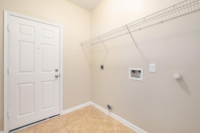 11430 Alcott Dr, Montgomery, TX 77356 - clothes washing area featuring hookup for a washing machine, light tile patterned floors, and electric dryer hookup