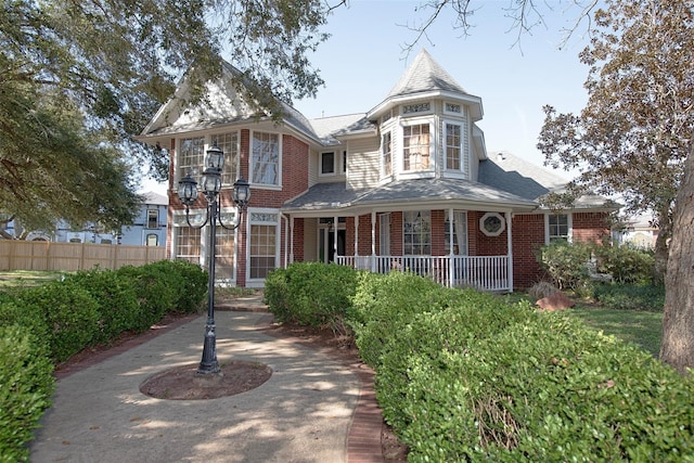 victorian-style house featuring covered porch