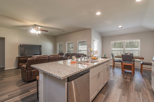 kitchen with sink, white cabinetry, dark hardwood / wood-style floors, dishwasher, and an island with sink