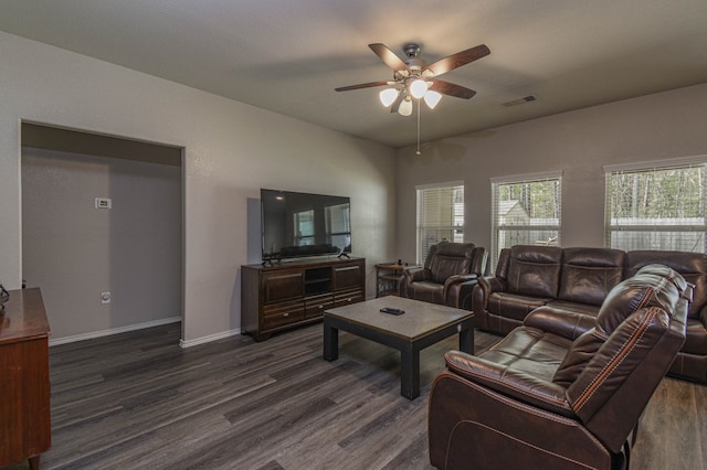 living room featuring ceiling fan and dark hardwood / wood-style flooring